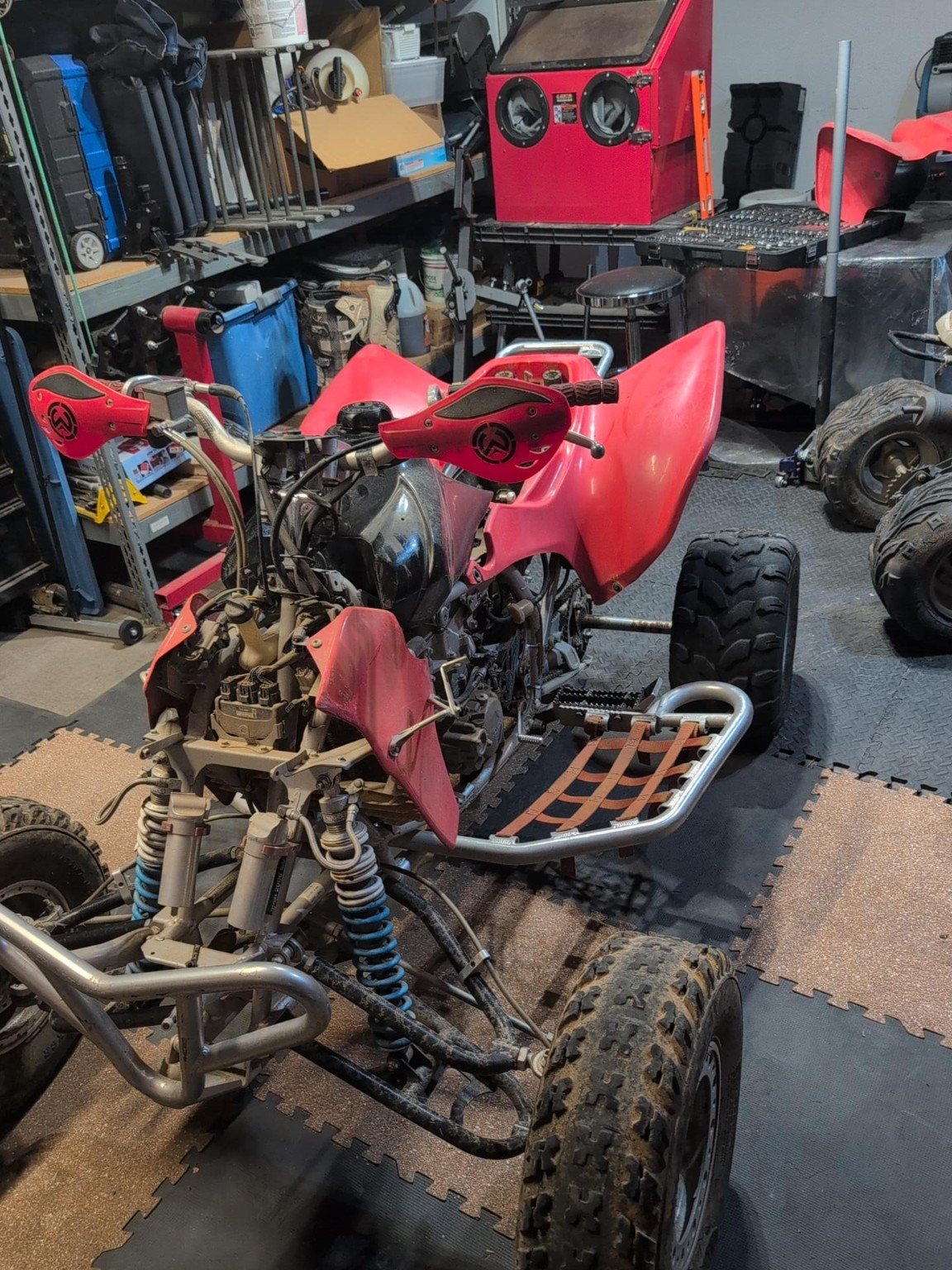 Honda TRX450 in the shop for engine diagnosis