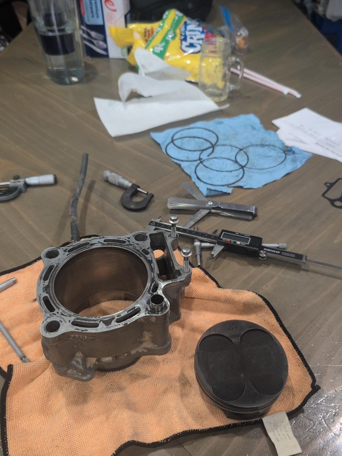 Honda TRX450 cylinder and piston removed for inspection